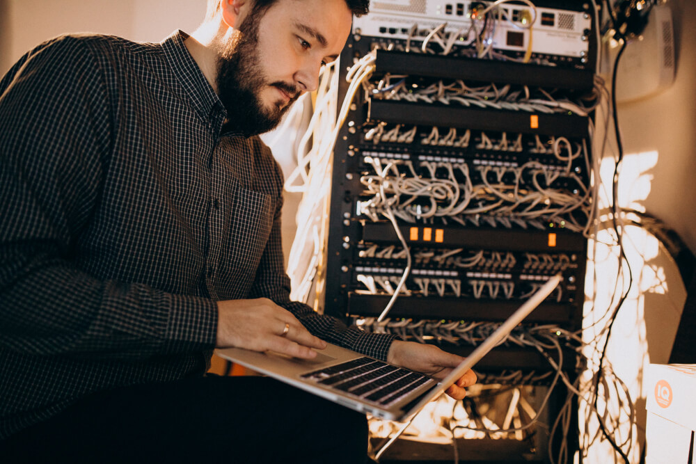 young it service man repairing computer